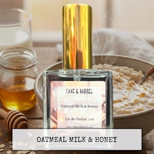 May include: A white ceramic mug with a black handle and the text "But First, Coffee" in a black, handwritten-style font. The mug is on a white surface.