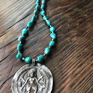 Kingman turquoise, antique hill tribe silver from Thailand w antique Indian silver Hindu pendant .