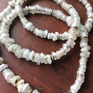 Antique frosty white Dutch wound glass beads w African brass on leather cord.