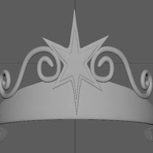 May include: A silver tiara featuring a five-pointed star design and ornate scrollwork.