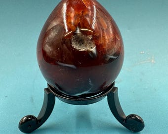 Carnelian egg - brimming with warm hues that evoke the fiery beauty of a desert sunset