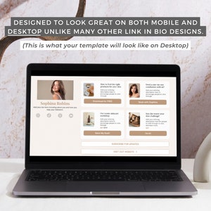 May include: A laptop computer screen displaying a website with a light brown background. The website features a woman's headshot, a call to action to subscribe for updates, and a link to visit the website. The text on the screen reads "Sophina Robins", "Subscribe for Updates", and "Visit Out Website".
