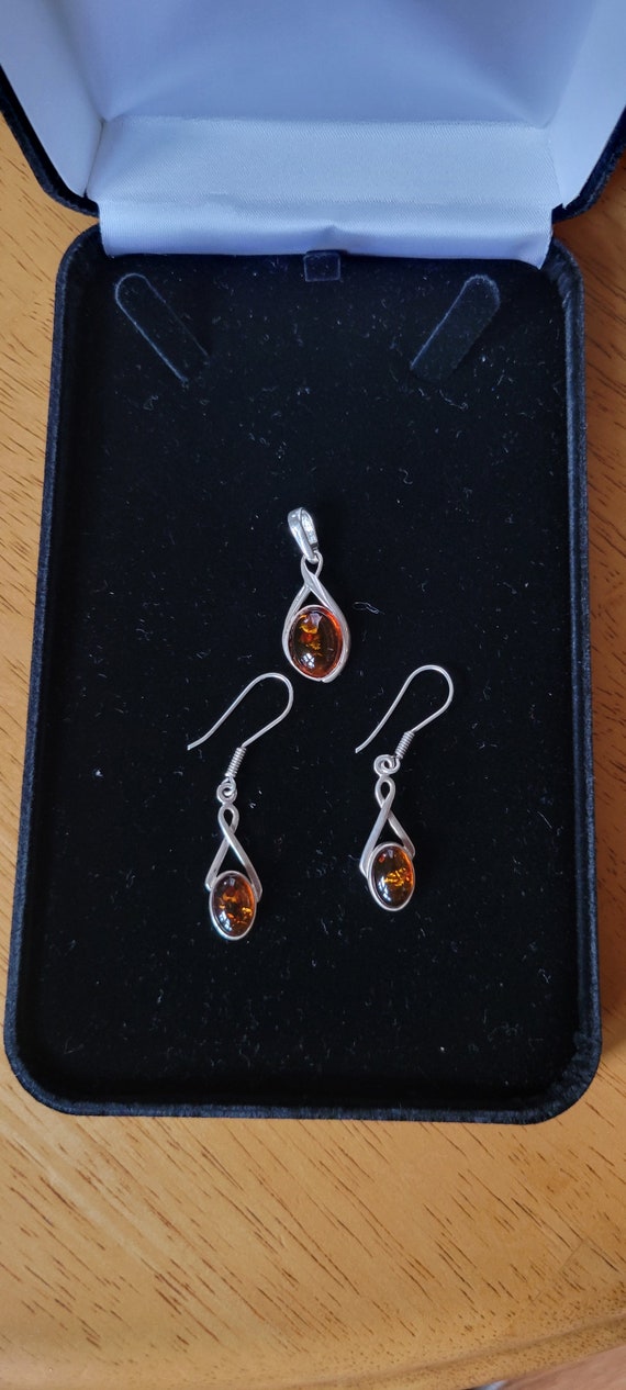 sterling silver and amber earrings and pendant set