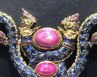 Sophisticated two head the king of Nagas( asia's dragon)  with two huge oval ruby and multi blue sapphire in princess sliver was enamel gold