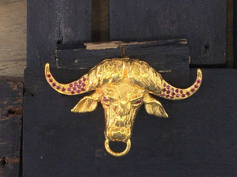 Buffalo brooch sliver shops or gold with ruby , enameled black