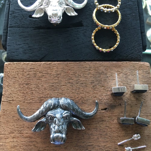 Buffalo brooch sliver shops or gold with ruby , enameled black