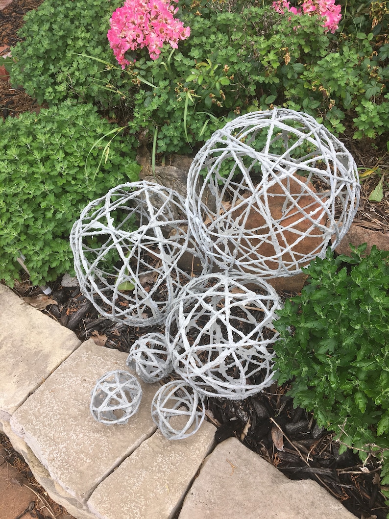 Concrete orb garden spheres. image 1
