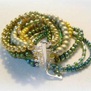 MULTI STRAND BRACELET - golds, yellows and greens