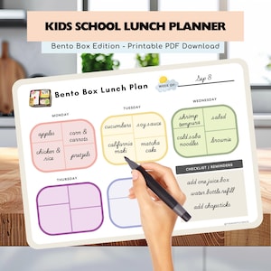 May include: A printable Kids School Lunch Planner, Bento Box Edition, with a weekly layout. The planner includes sections for each day of the week, with space to plan meals like apples, chicken & rice, and California maki. A hand is holding a pen, ready to fill in the plan.