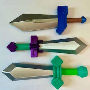 May include: Three toy swords with silver blades and colorful handles. The top sword has a blue handle and brown grip. The middle sword has a purple handle and green grip. The bottom sword has a green handle.