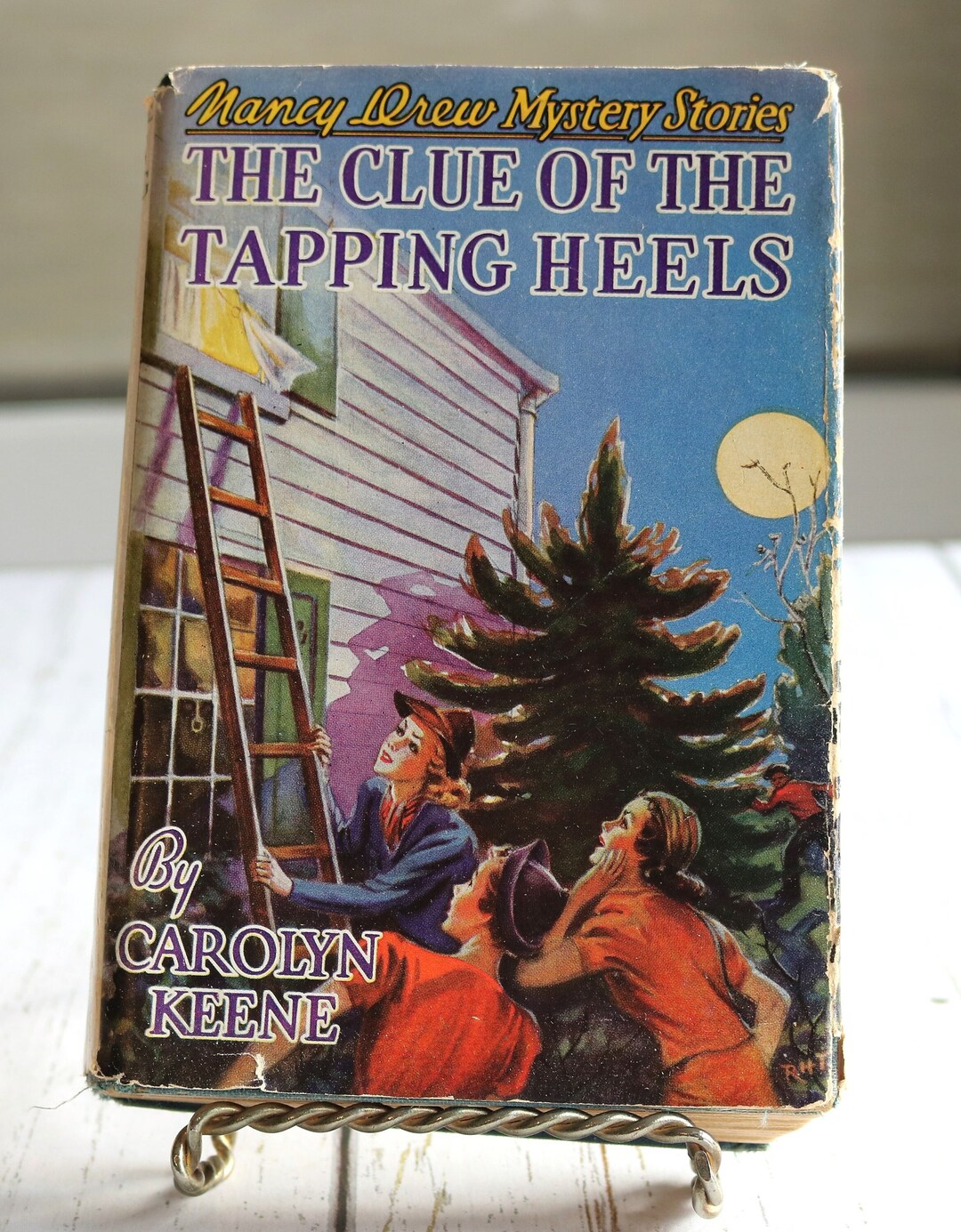 Nancy Drew Book 16: The Clue Of The Tapping Heels - Hardcover Edition (Used - Good)