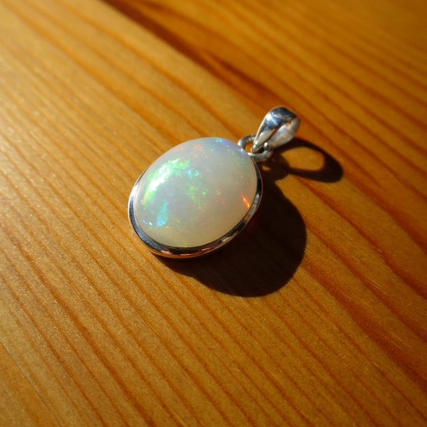 Beautiful Small Oval White Ethiopian Multi-coloured Opal Cabochon Pendant in Sterling Silver Setting