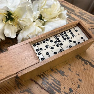 Vintage set of dominoes in a wooden box