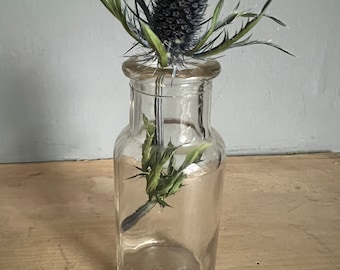 Old small glass bottle, ideal as a posy vase