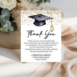 May include: A rectangular graduation thank you card featuring a black mortarboard with a gold tassel at the top, surrounded by gold glitter accents. The text reads Thank You, followed by a message of gratitude, and the name Christina Smith.