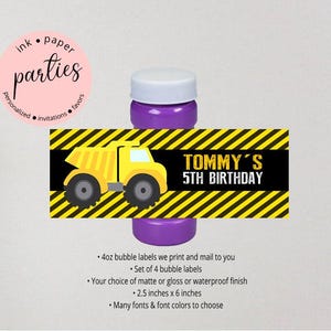 May include: A purple bubble bottle with a rectangular label featuring a yellow dump truck, black and yellow hazard stripes, and the text Tommy's 5th Birthday. The label measures 2.5 inches by 6 inches and is designed for 4oz bubble bottles.