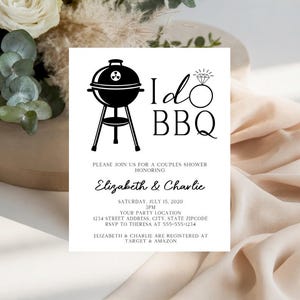 May include: A white rectangular invitation card featuring a black graphic of a charcoal grill and a diamond ring icon. The text reads I Do BBQ, Please join us for a couples shower honoring Elizabeth & Charlie, Saturday, July 15, 2020, 3PM.