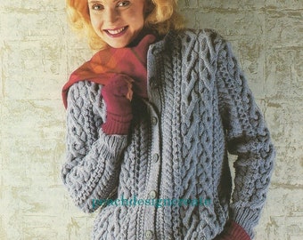 May include: A light blue knitted cardigan with a cable knit pattern and button closure. The cardigan has a V-neck and long sleeves.