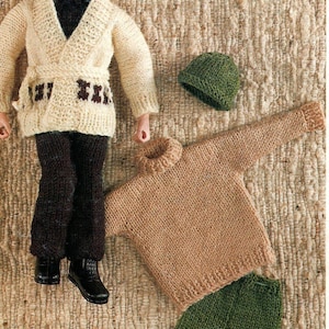 May include: A set of knitted doll clothes including a white cardigan with a brown belt, brown pants, a brown turtleneck sweater, green pants, and two green hats.