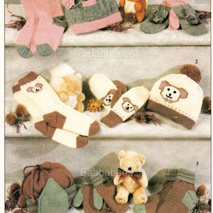 May include: A collection of knitted baby accessories, including socks, hats, and mittens, in various colors like pink, brown, and green. Some items feature teddy bear designs. The image includes the text "babbabees".