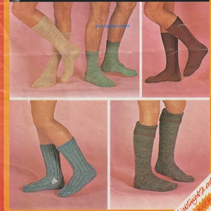 May include: Four pairs of socks in different colours and patterns. The socks are all knee-high and have a ribbed texture. The socks are displayed on a pink background.