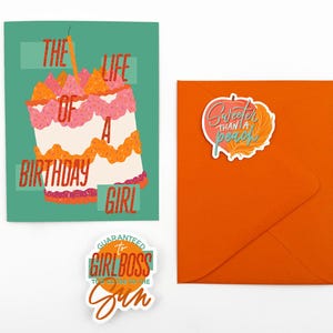 May include: A birthday card with a cake illustration and the text "The Life of a Birthday Girl." An orange envelope with a sticker that says "Sweeter than a peach." A sticker that says "Guaranteed to be the Girlboss to the Sun."