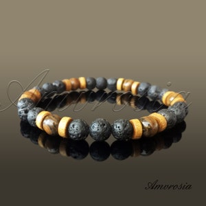 Può includere: Un braccialetto di perline di lava nera e legno. Il braccialetto presenta perline alternate di lava nera e legno marrone con una perlina di occhio di tigre.