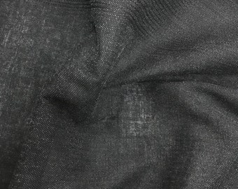 May include: Black sheer fabric with a subtle sparkle. The fabric has a fine mesh texture and is slightly wrinkled.