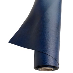 May include: A roll of dark blue vinyl fabric with a textured surface.