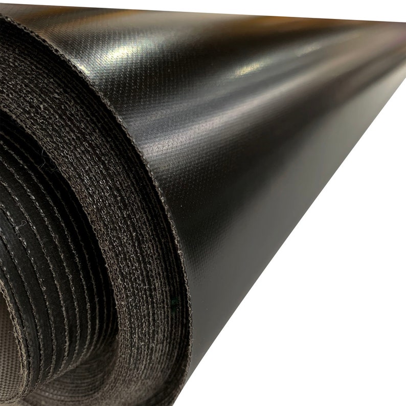 May include: A roll of black, waterproof fabric. The fabric is tightly rolled and has a smooth, shiny surface.
