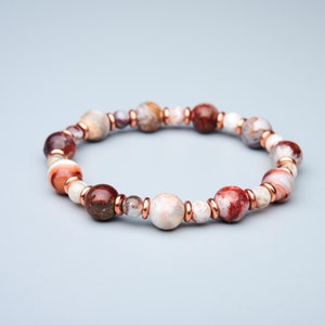 Natural untreated multicolor Laguna Lace Agate solid copper stretch bracelet