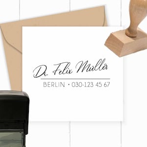 May include: A black self-inking stamp with the text "Dr. Felix Muller, BERLIN 030-123 45 67".