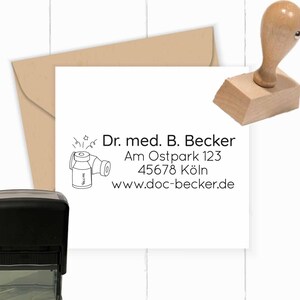 May include: A black and white stamp with a doctor's contact information. The stamp features a cartoon image of a vial of vaccine with stars around it. The text reads: Dr. med. B. Becker, Am Ostpark 123, 45678 Köln, www.doc-becker.de