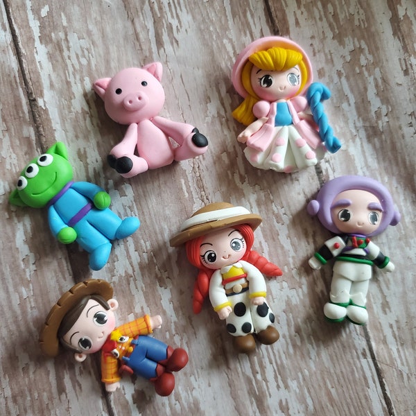 CLAYS: TOYS At PLAY, clay doll, clay dolls, bow centerpieces, clay center for bows, bow center, woody, buzz, clay pieces for hair bows