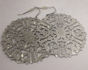 Beautiful shiny silvery earrings and elegant goldy earrings