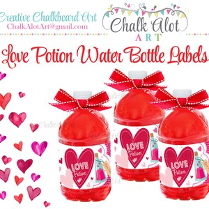 May include: Three red water bottles with white labels that say "Love Potion" in pink lettering. The labels have a pink heart with a stitched border and a small bottle of potion with a pink heart on the label. The bottles are tied with red and white polka dot ribbon.