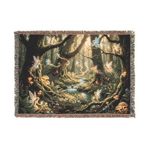 May include: A rectangular woven throw blanket featuring a detailed forest scene with multiple winged fairies, a flowing stream, mossy trees, and various mushrooms. The edges of the blanket are finished with a decorative fringed border.