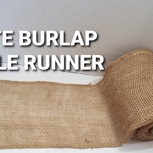 May include: A roll of natural jute burlap table runner. The runner is made of a coarse, woven fabric and is perfect for adding a rustic touch to any table setting.