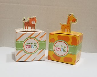 May include: Two small, square gift boxes with animal toppers. The box on the left has a tiger topper and the box on the right has a giraffe topper. Both boxes have a green and white striped ribbon with the text "Born to be WILD" in colorful letters.