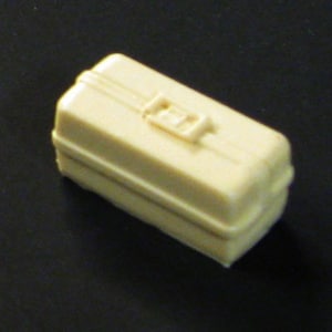 May include: A small, off-white plastic toolbox with a latch.