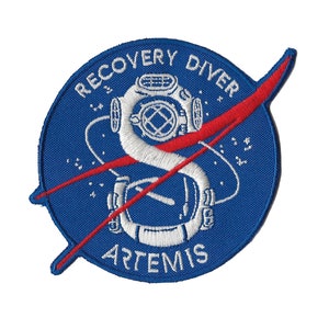 May include: A blue and red embroidered patch with the text "Recovery Diver Artemis" and a white illustration of a diving helmet.