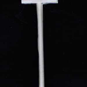 May include: A white plastic mallet with a long handle. The mallet is used for pounding and crushing.