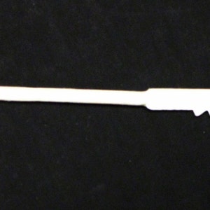 May include: A white plastic key with a serrated edge and a small loop at the top.