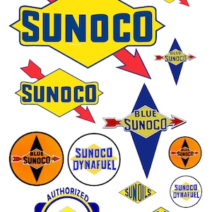 May include: A collection of vintage Sunoco petrol station logos and signs. The logos feature a yellow diamond shape with the word "SUNOCO" in blue letters. Some logos also include the words "Blue Sunoco", "Sun Oils", and "Dynafuel".