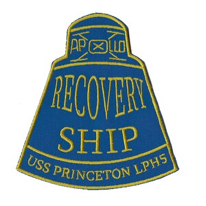 May include: A blue and gold embroidered patch with the text "APOLLO RECOVERY SHIP USS PRINCETON LPHS".