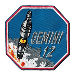 May include: Embroidered patch with a rocket design and the text "GEMINI 12" on a blue background. The patch has a red and white border and a stylized rocket launch illustration.
