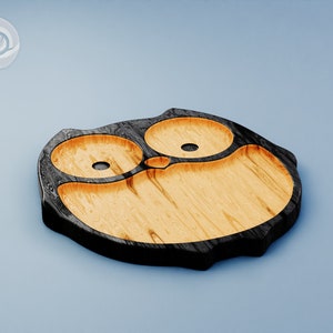 May include: A wooden owl-shaped serving tray with three compartments. The tray is made of light wood with a dark wood border.