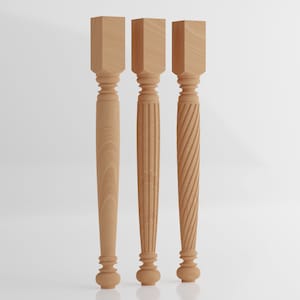 May include: Three wooden table legs with different carved designs. The legs are all the same height and width, but have different patterns. The first leg has a simple, straight design. The second leg has a fluted design. The third leg has a spiral design.