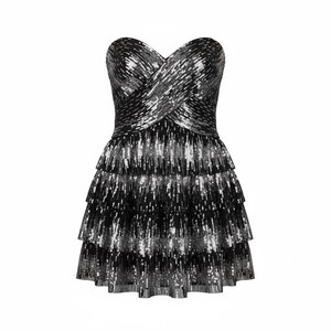 May include: A strapless mini dress featuring a sweetheart neckline with a crisscross bodice design. The garment is covered in black and silver sequins arranged in a vertical pattern, with a three-tiered ruffled skirt that flares at the hem.