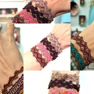 May include: A collection of beaded bracelets in various colors, including pink, brown, and teal. The bracelets feature intricate floral patterns and are displayed on a wrist. The beads appear to be small and metallic, creating a delicate and ornate look.